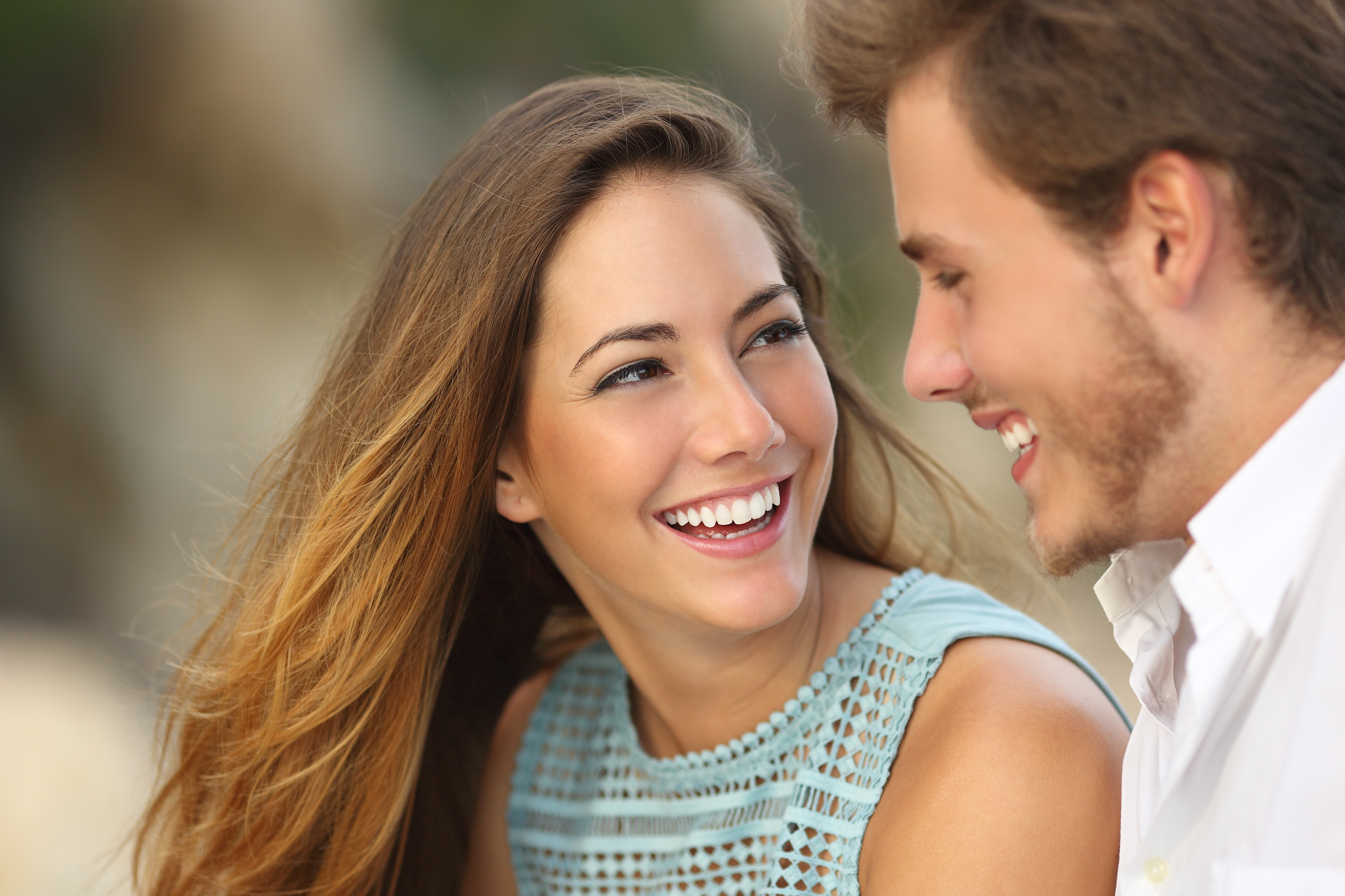 A couple smiling at each other | Source: Shutterstock