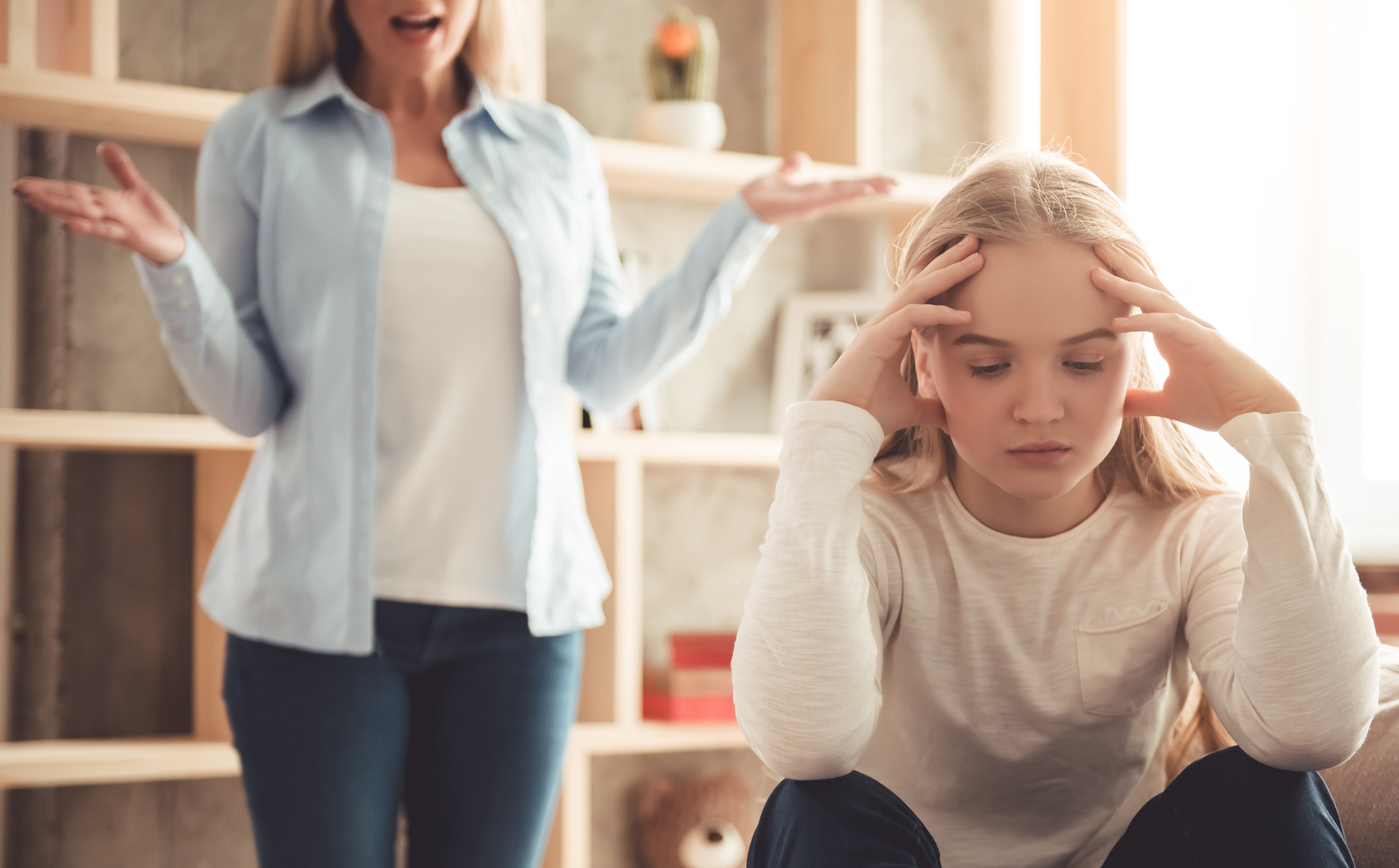 A woman scolding a young girl | Source: Shutterstock