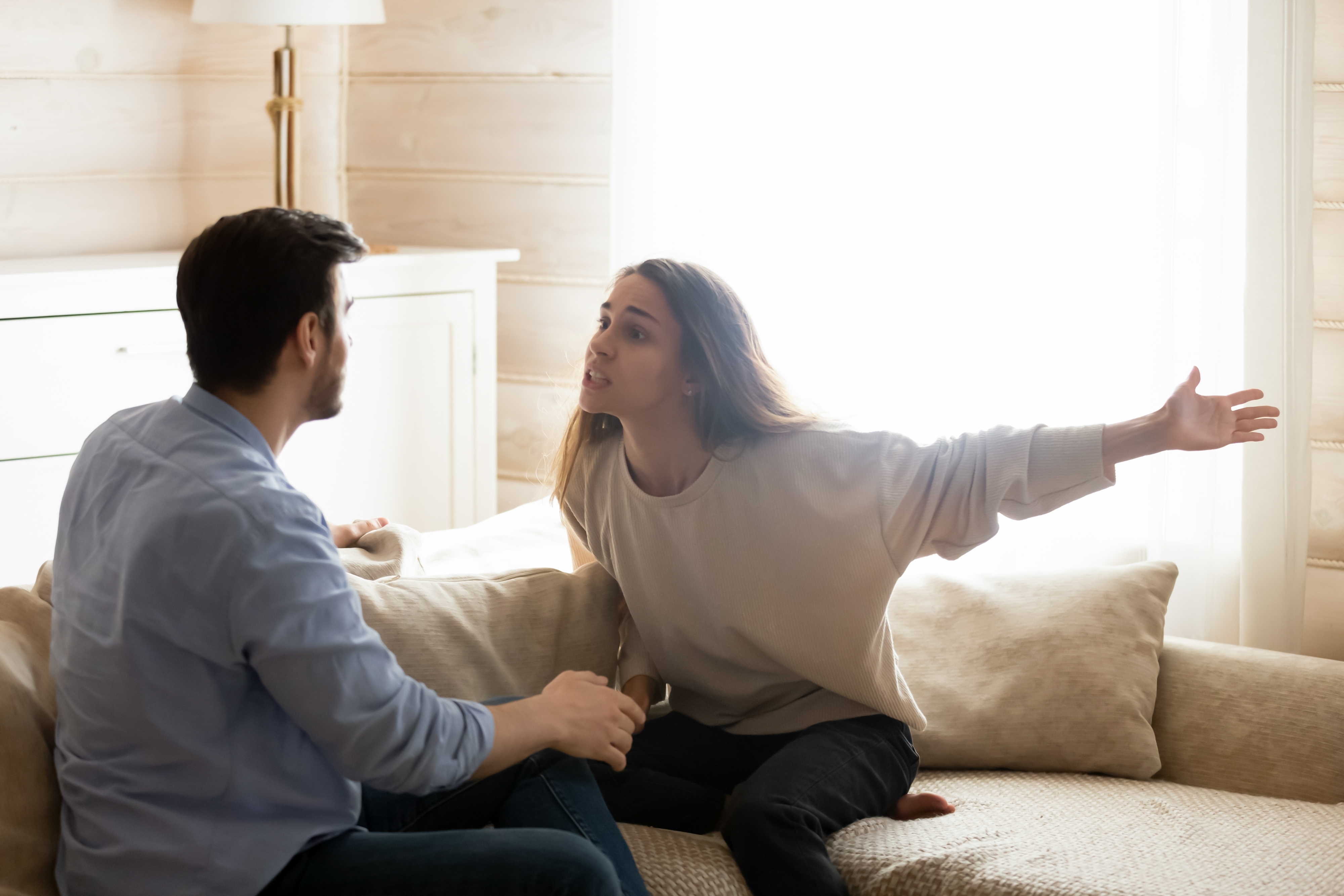 Misunderstanding. Angry worried young spouses quarreling arguing at home. | Source: Shutterstock