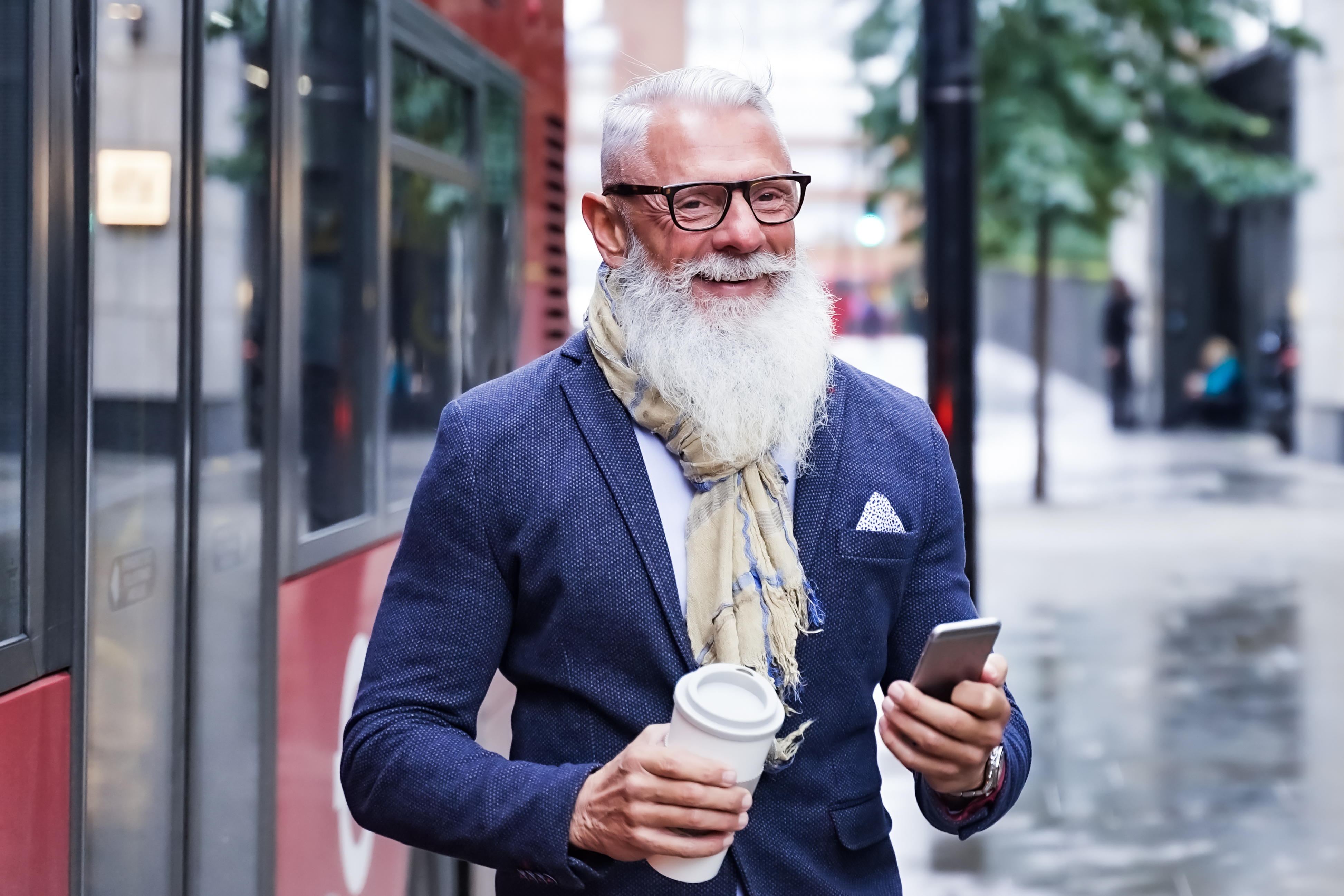 An older man walking on a street | Source: Shutterstock