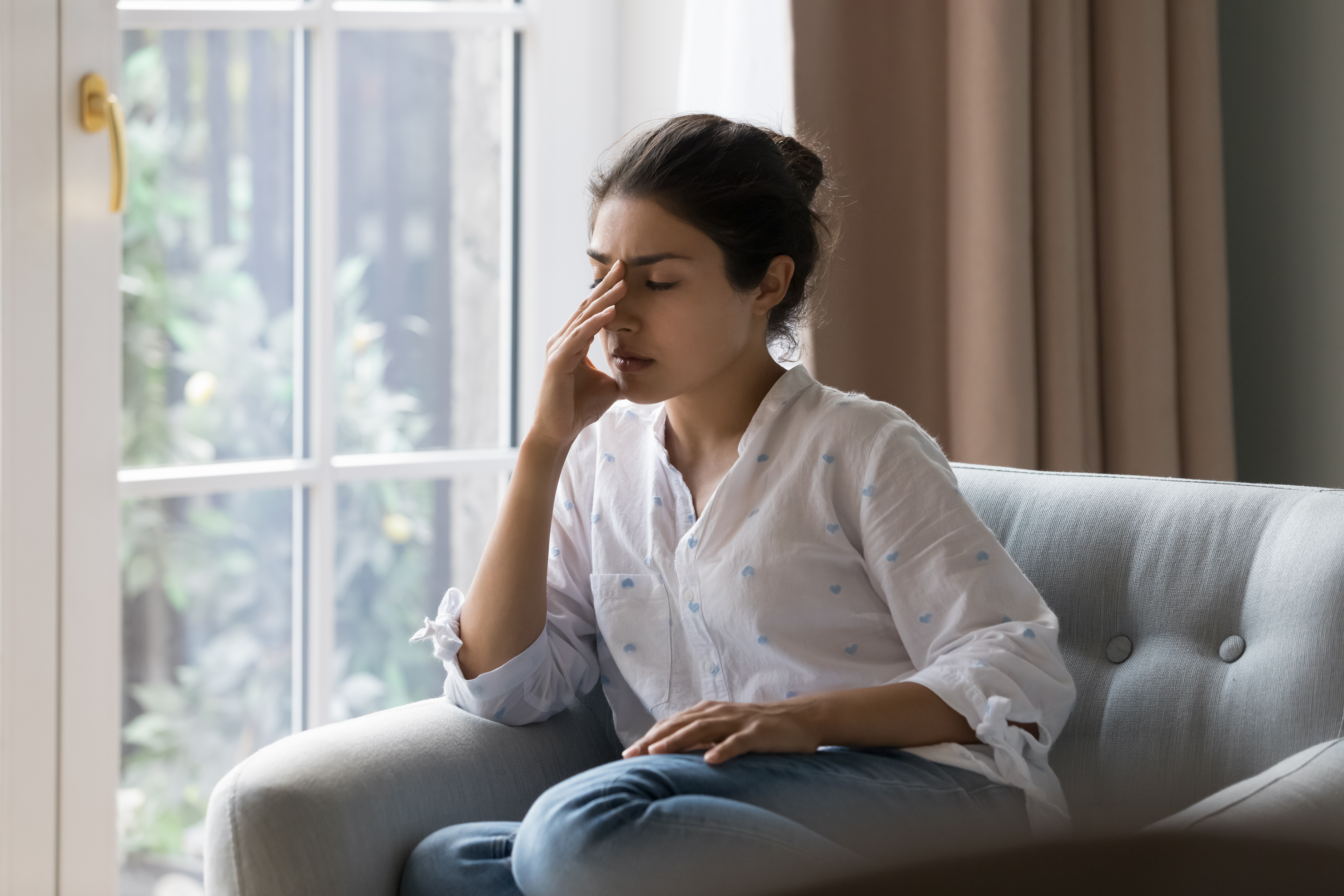 Depressed frustrated young woman | Source: Shutterstock