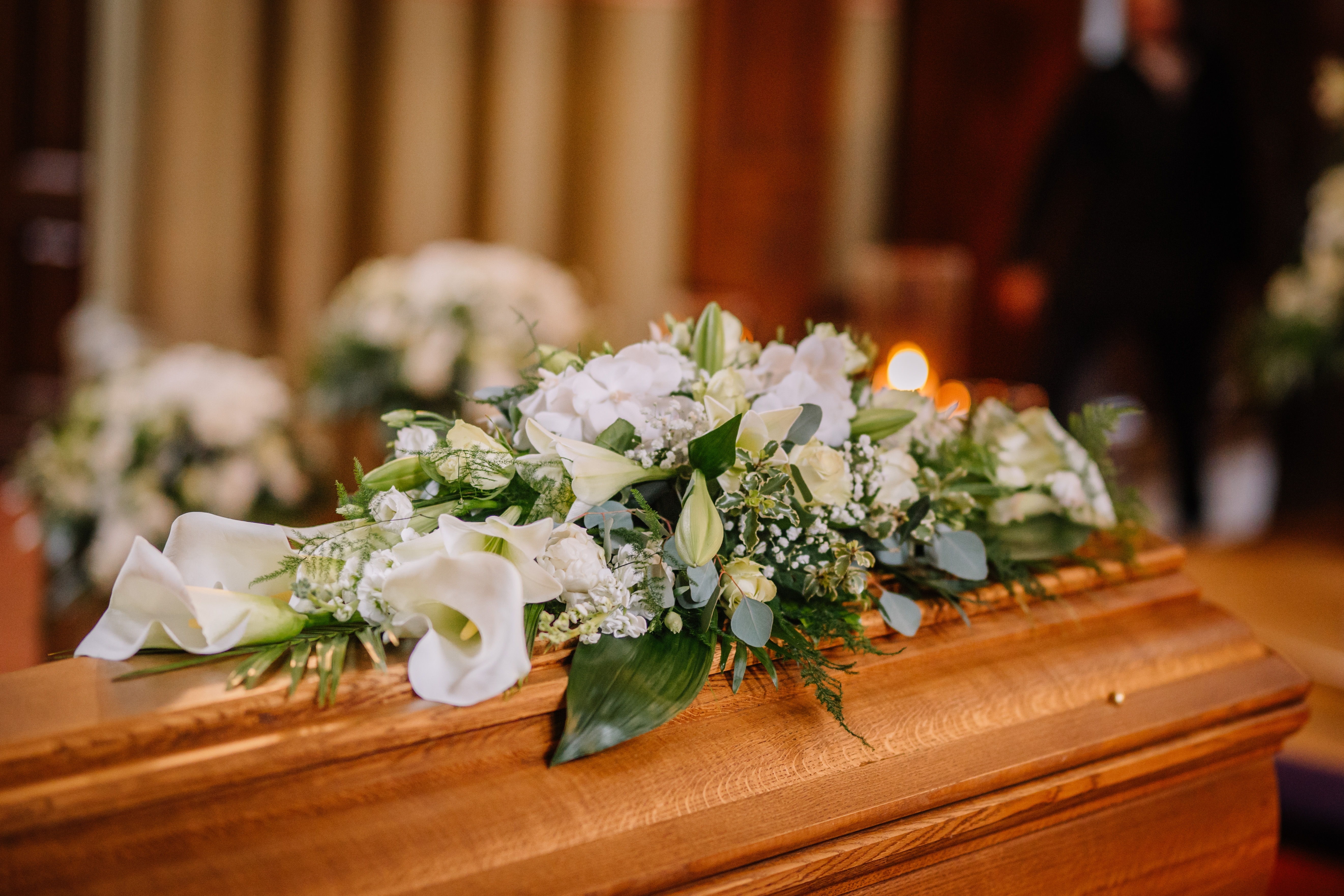 A coffin decorated with flowers | Source: Shutterstock