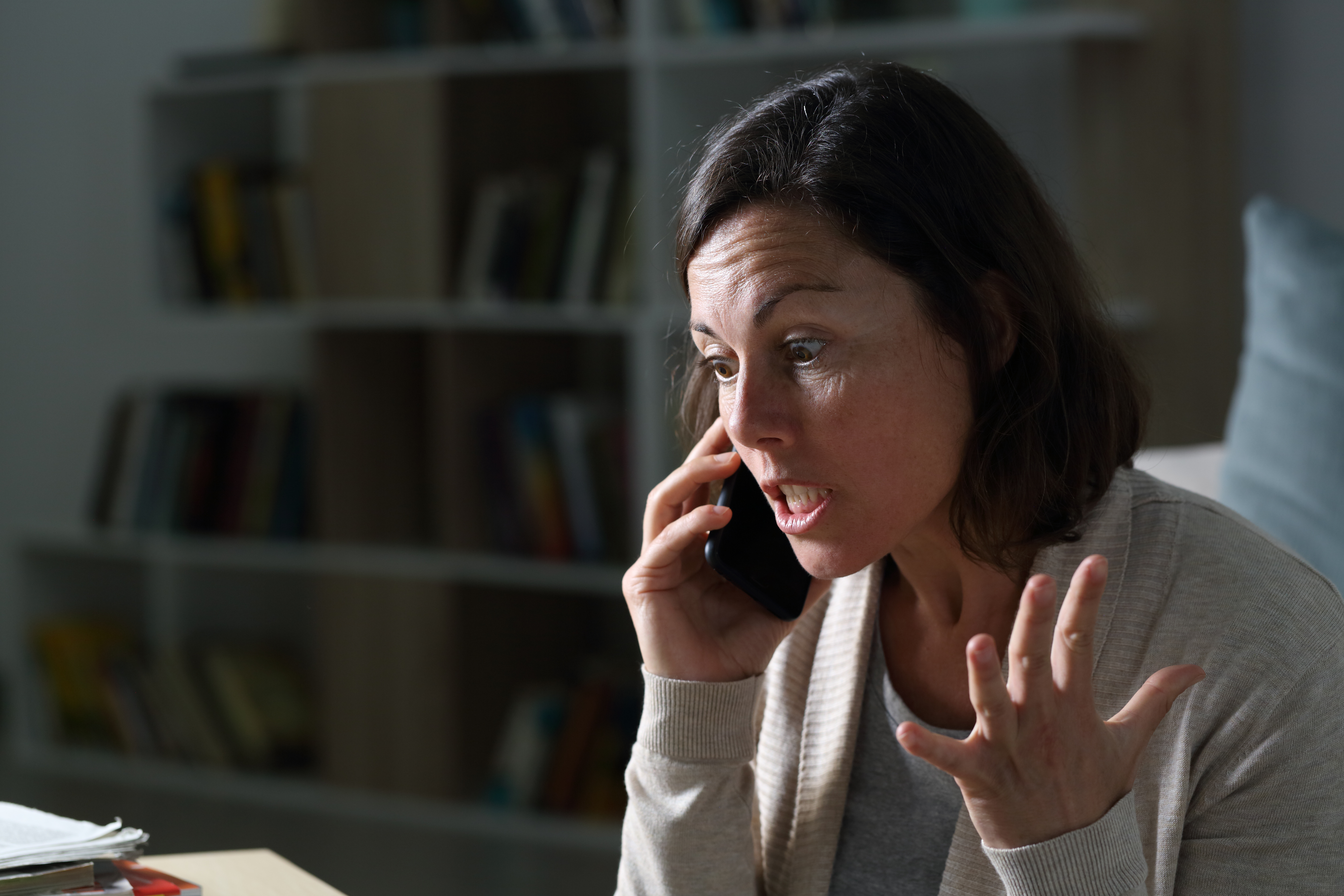 An angry woman on a call | Source: Shutterstock