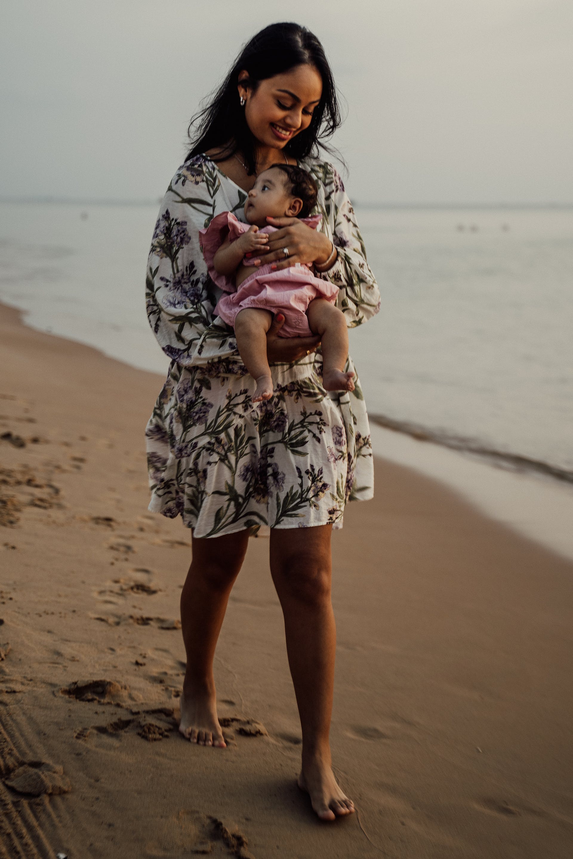 A woman with her baby on the beach | Source: Pexels