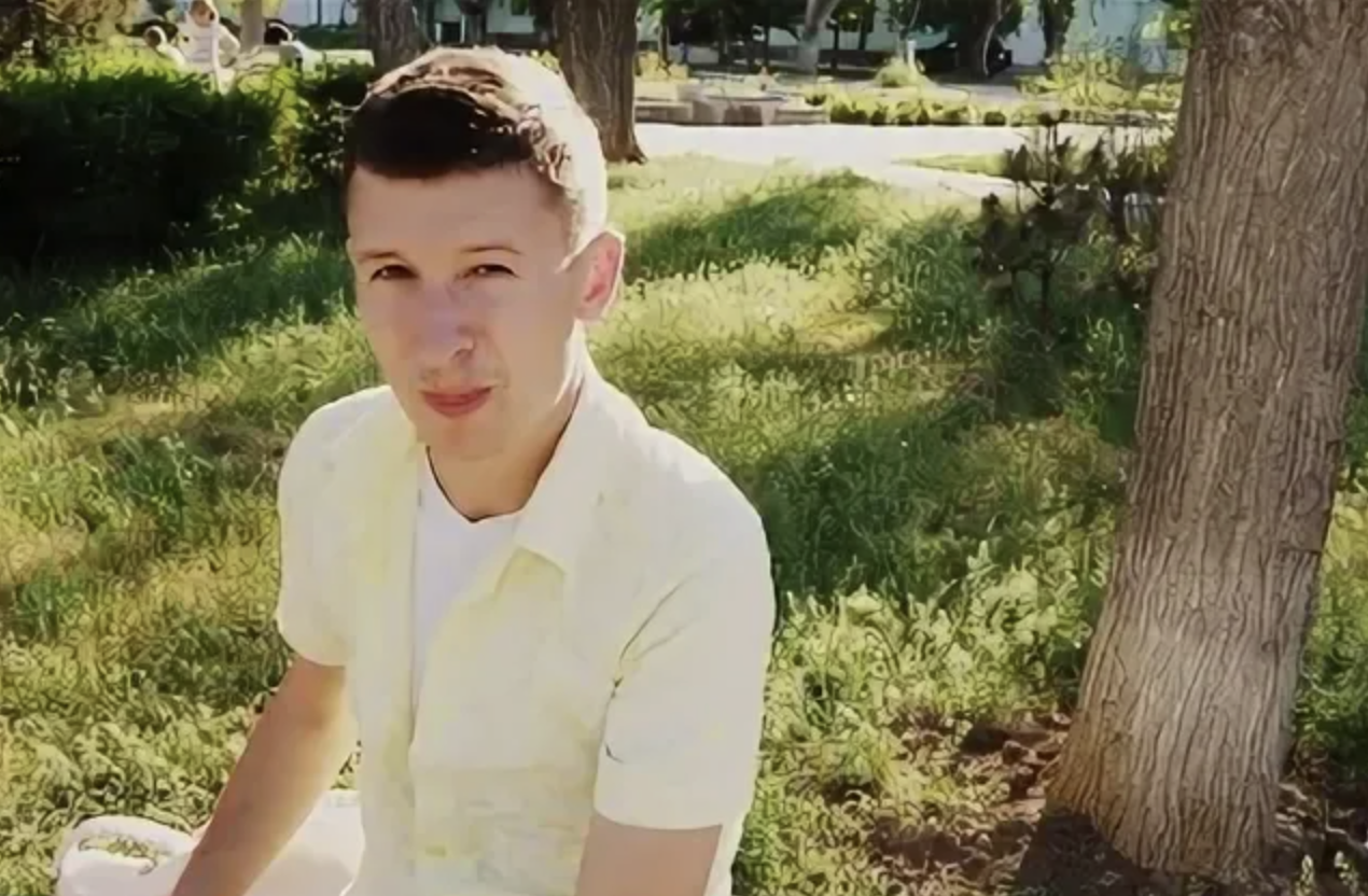 Teen boy near the tree | Source: Shutterstock