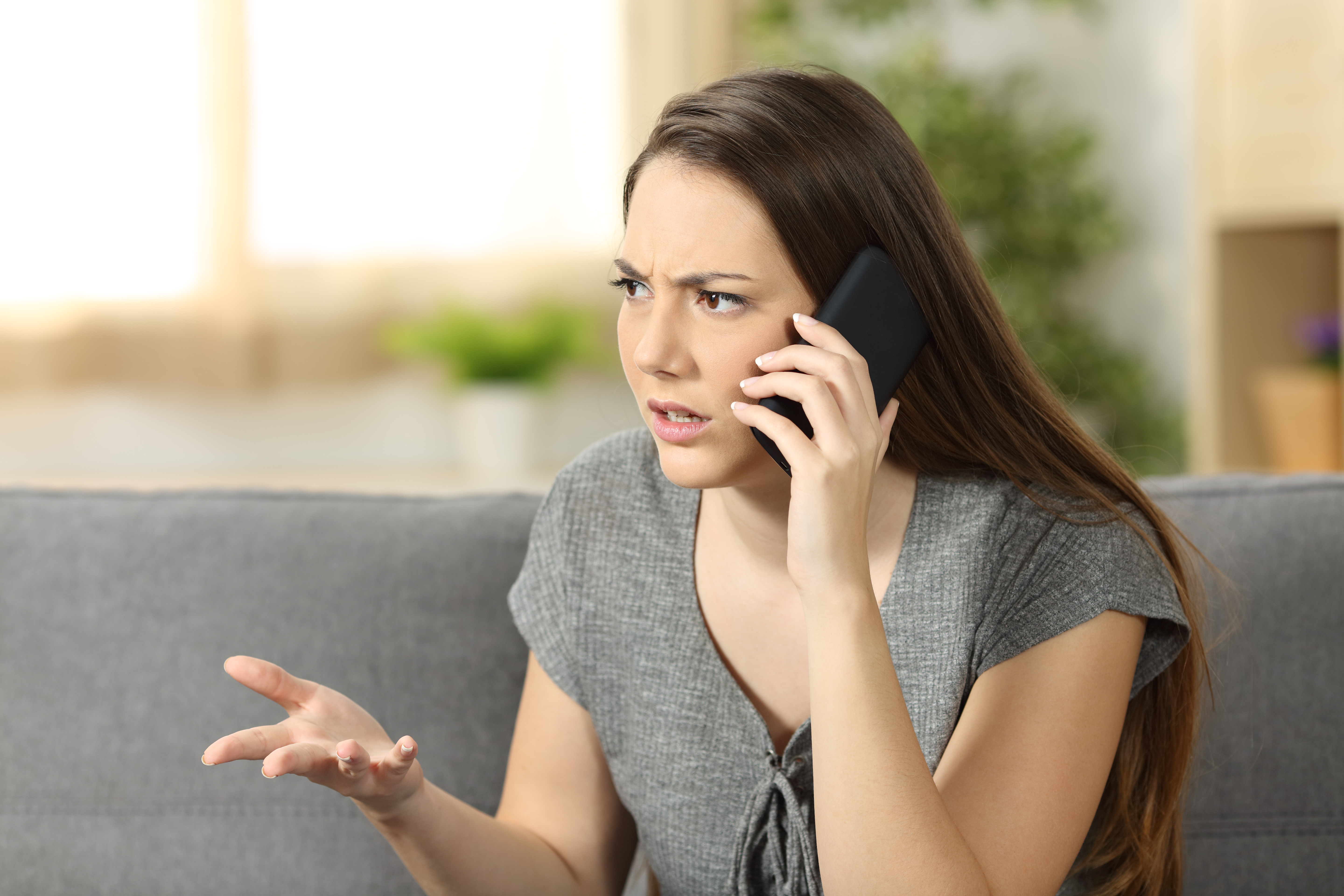 A woman attending a phone call | Source: Shutterstock