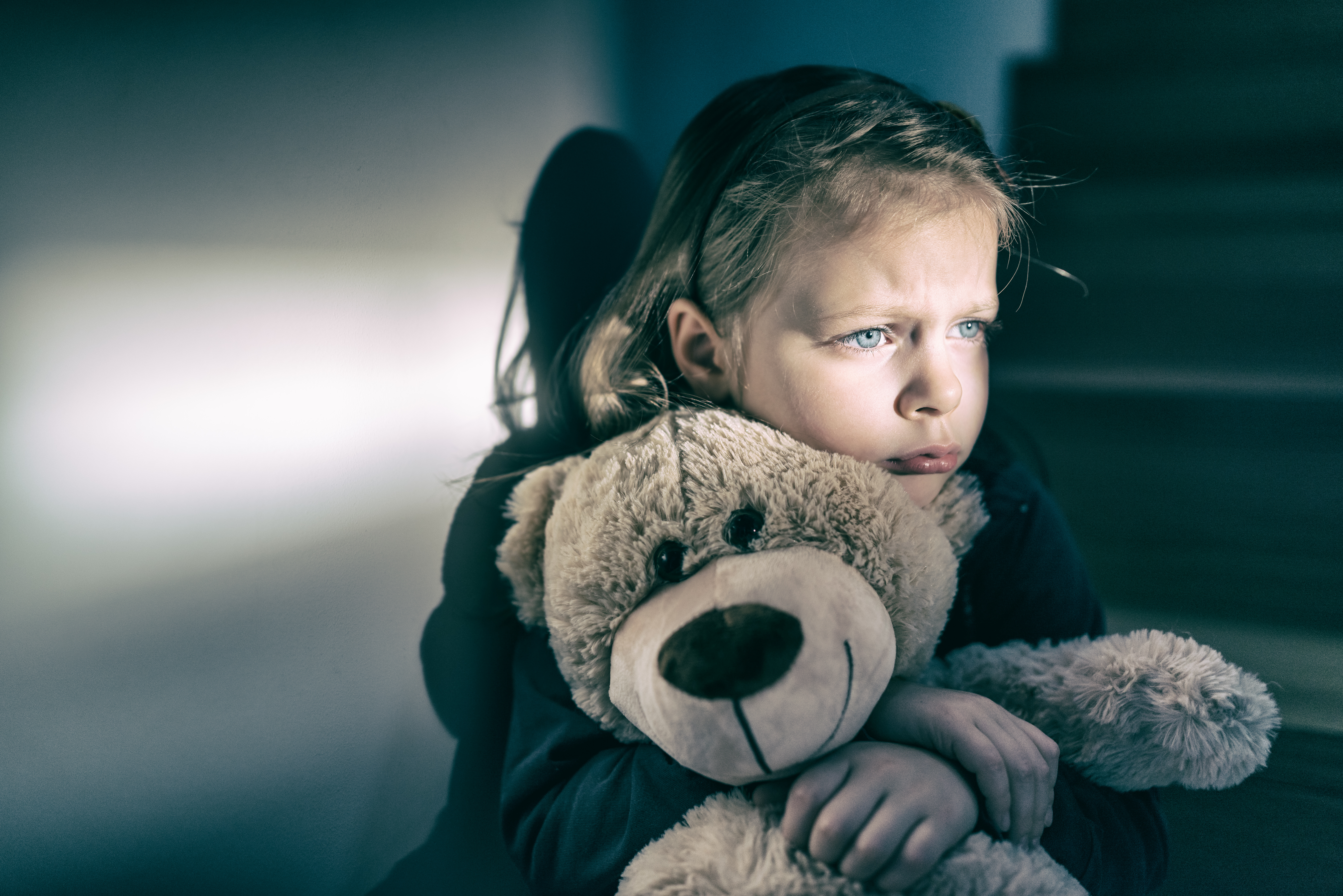 Little girl holding a teddy bear | Source: Shutterstock