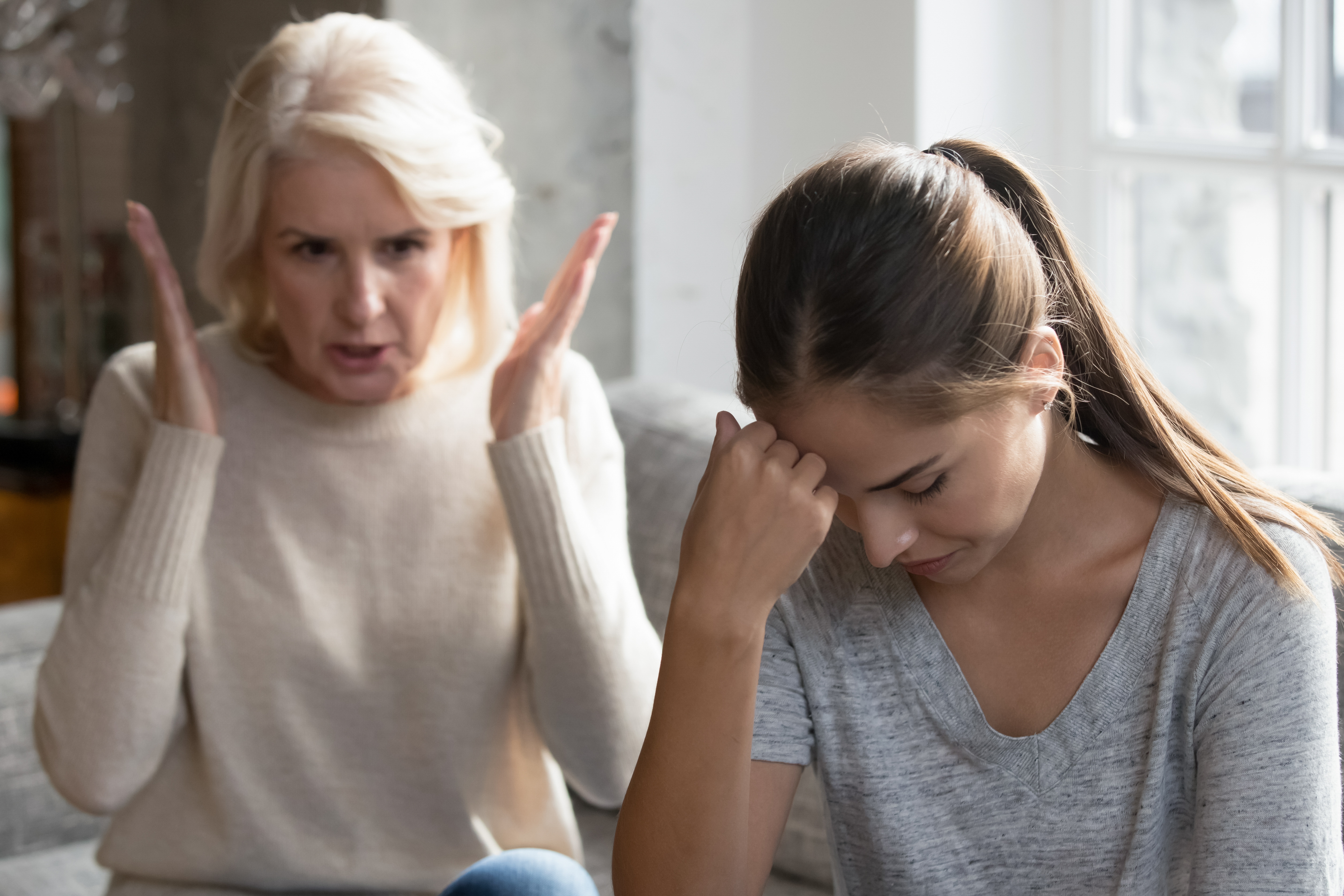 A woman arguing with a young girl | Source: Shutterstock