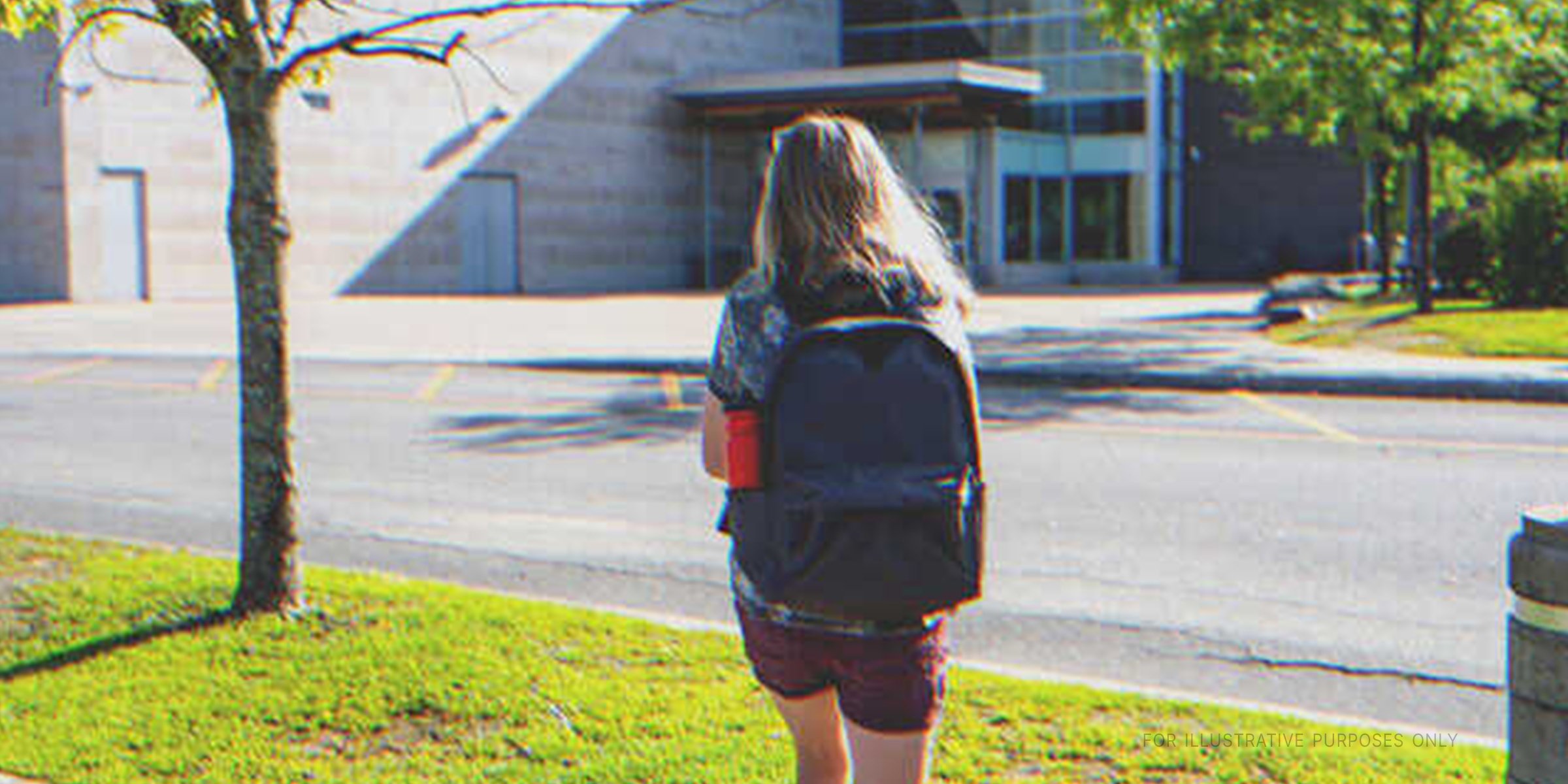 A teenage girl walking to school | Source: Shutterstock