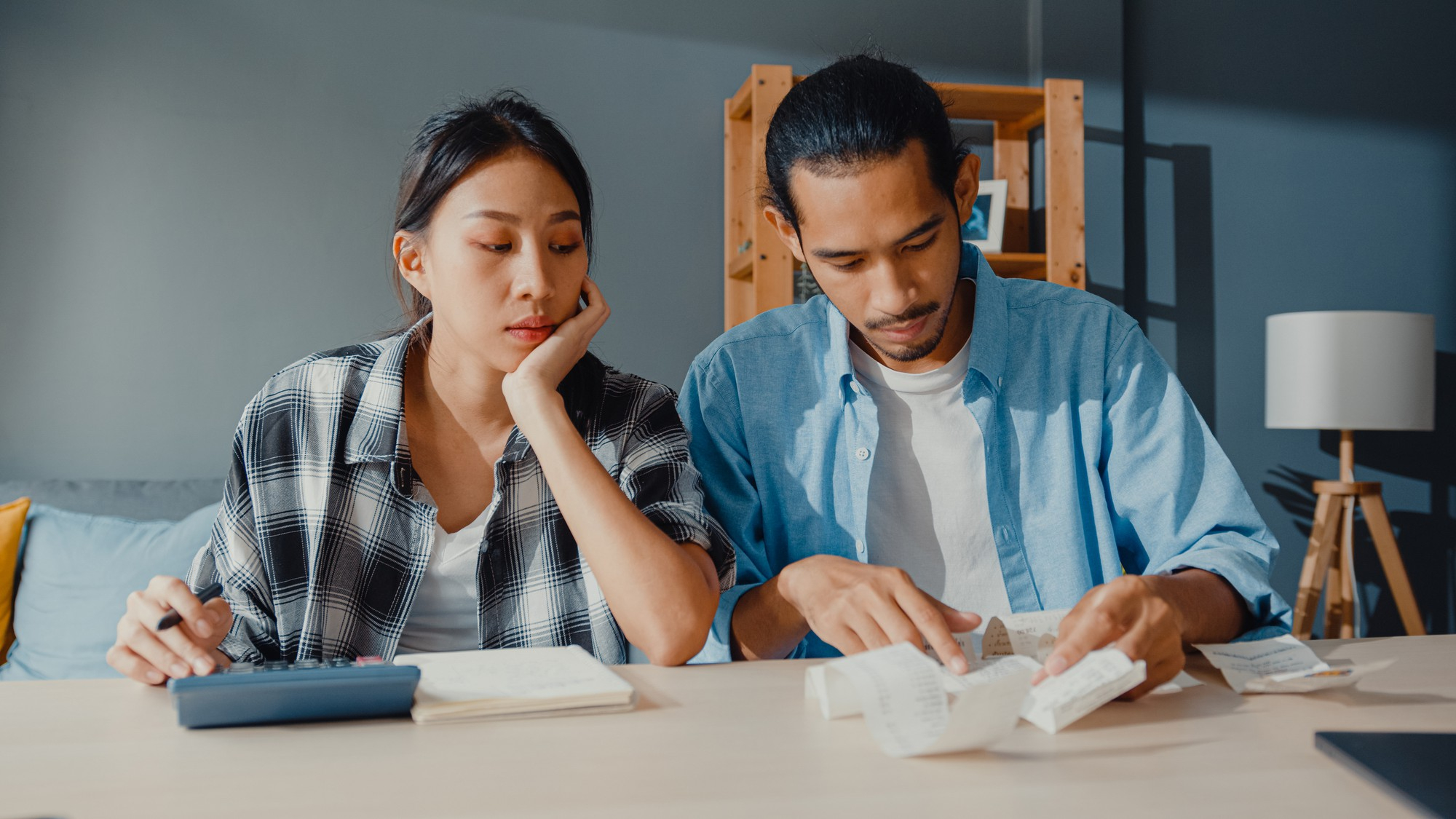 A couple looking at reports | Source: Freepik