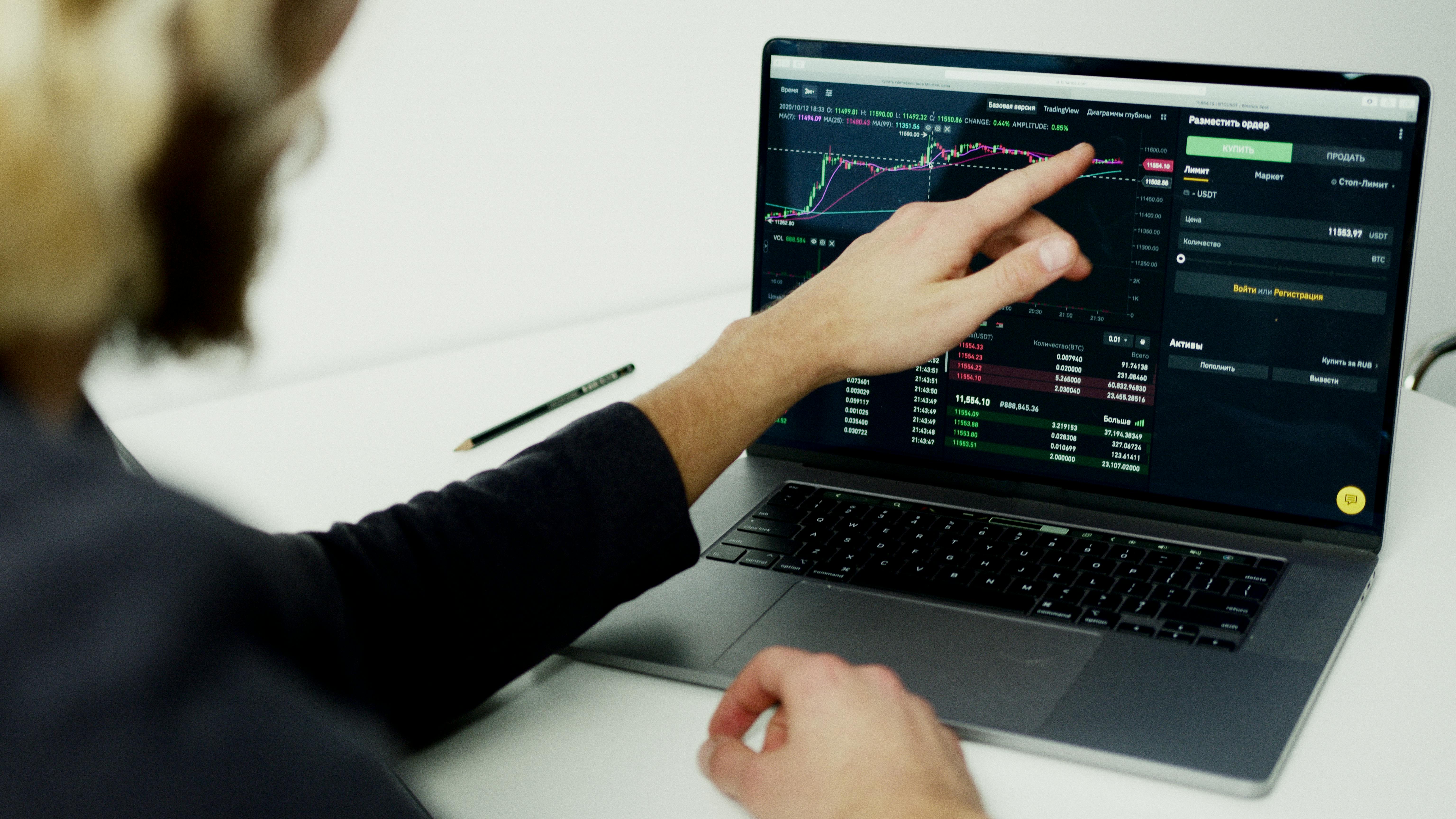Man checking a financial chart | Source: Pexels